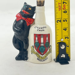 Antique Arcadian Crested China Lucky Black Cat & Bottle – Woolwich Crest – c.1924