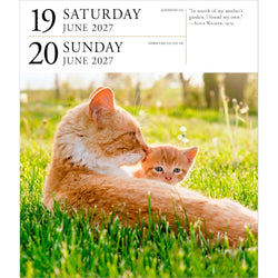 Calendar page with ginger cat and kitten in a grassy field, showing dates and a quote.