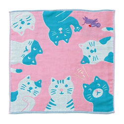 Pink towel with blue cat patterns on a white background