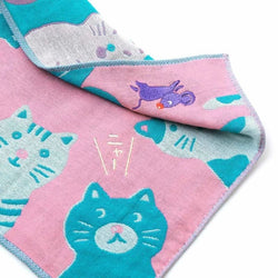 Pink and blue cat-patterned towel with a mouse illustration on a white background