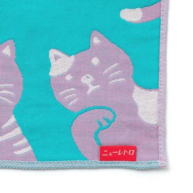 Cat-themed towel with a turquoise background and pink cat design