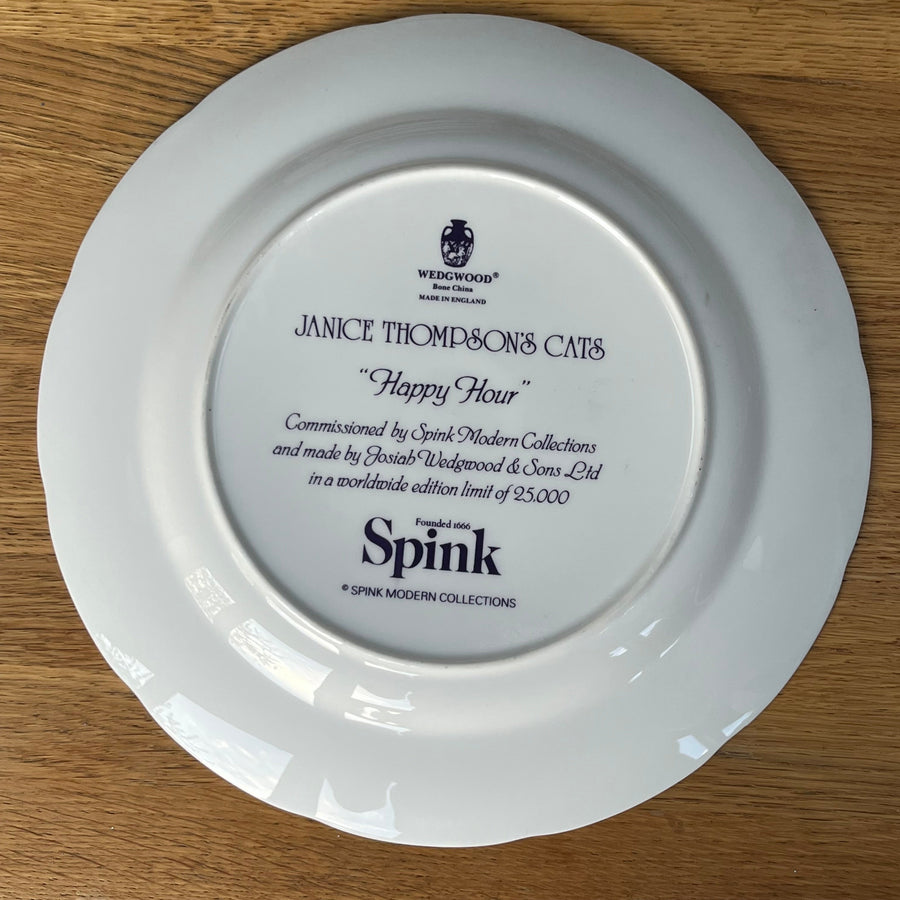 White plate with engraved text on a wooden surface