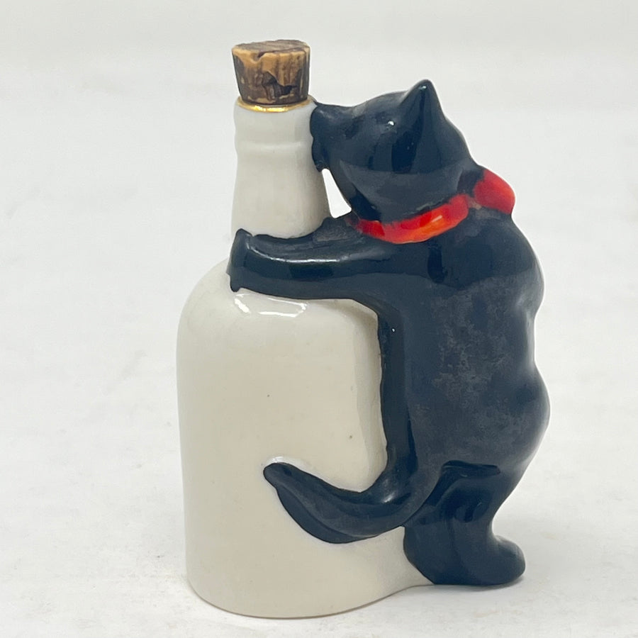 Antique Arcadian Crested China Lucky Black Cat & Bottle – Woolwich Crest – c.1924