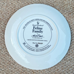 White plate with a decorative black label on a beige carpet