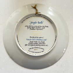 White decorative plate with text and a small bow on a white background