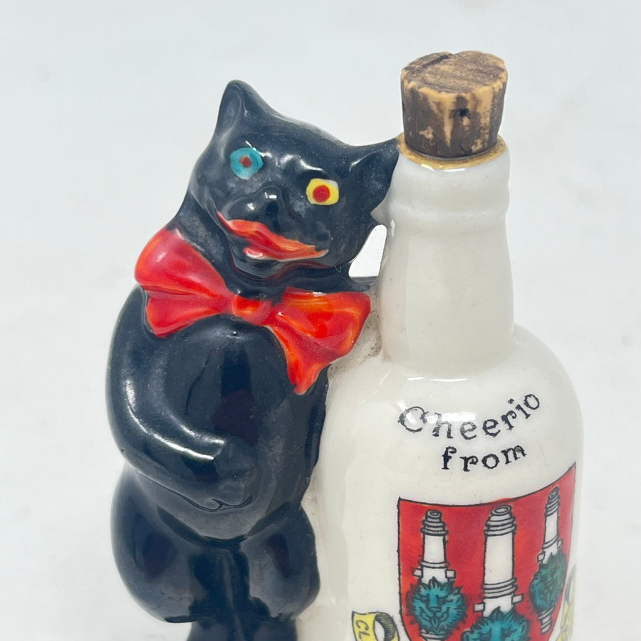 Antique Arcadian Crested China Lucky Black Cat & Bottle – Woolwich Crest – c.1924