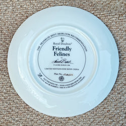 White plate with a black label on a beige carpet