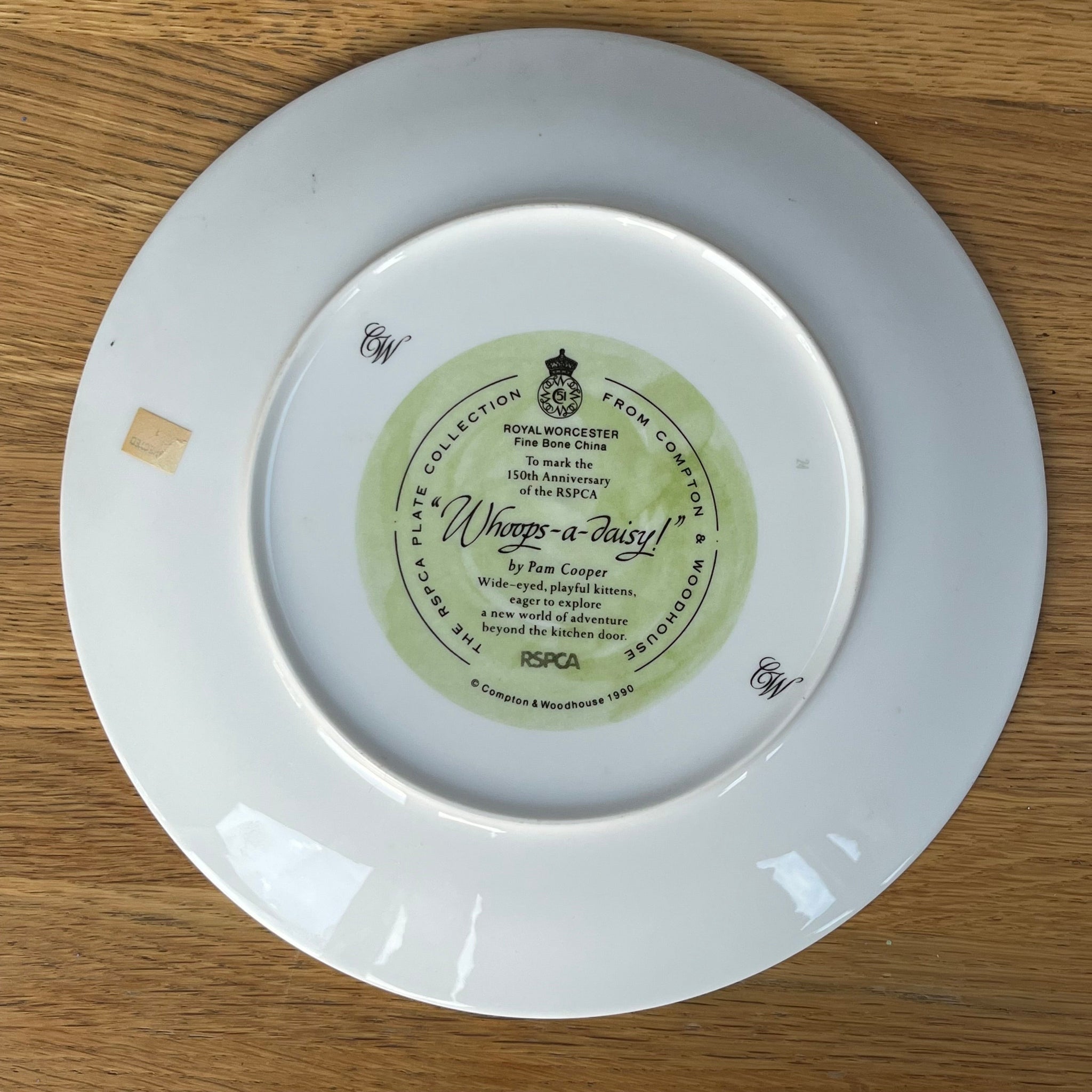 White plate with a green label on a wooden surface