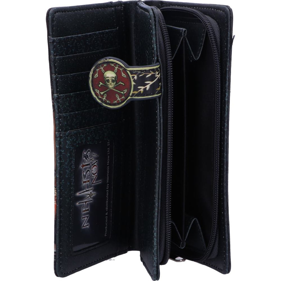 A black leather wallet shown open, featuring a skull and crossbones emblem with a red centre and gold branch details on the inside cover, alongside card slots and zip compartments.
