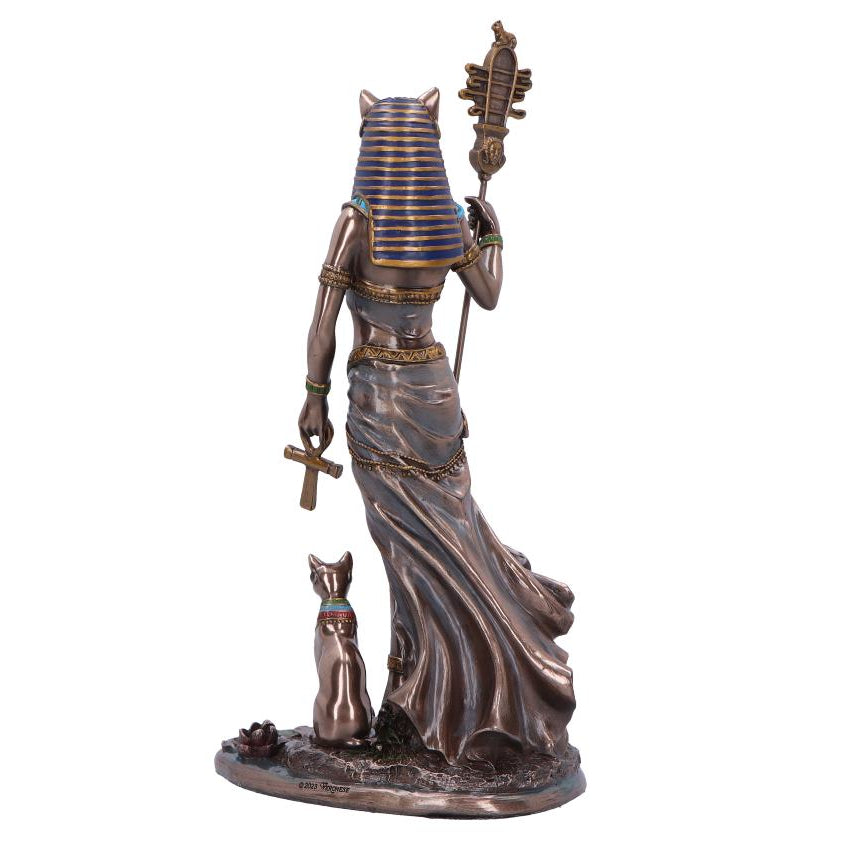 Statue of an Egyptian goddess with a cat on a white background