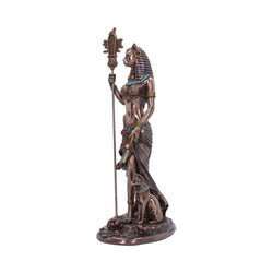 Bronze statue of an Egyptian goddess holding a staff on a white background