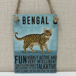 A rectangular hanging sign with a light blue background featuring a painted Bengal cat and black text reading 'BENGAL' and descriptive phrases. 