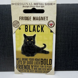 A packaged black fridge magnet shaped like a hanging card, featuring a black cat illustration and text that reads 'FRIDGE MAGNET' and 'BLACK'. 