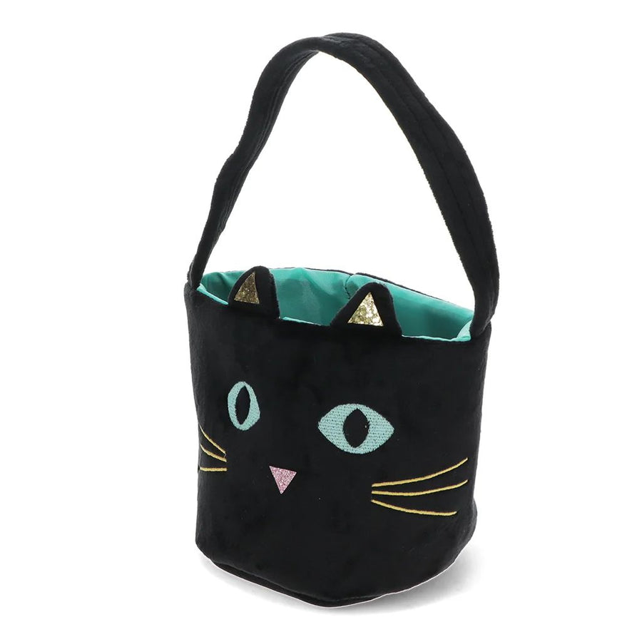 A black plush bucket bag designed like a cat's face, featuring embroidered light blue eyes, a pink nose, yellow whiskers, and a teal interior lining with gold triangular ear accents