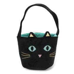 A black cat-shaped handbag with embroidered eyes, whiskers, nose, and pointed ears, featuring a turquoise interior lining and a black shoulder strap