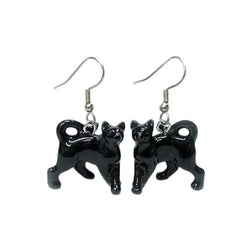 Black cat-shaped earrings on a white background