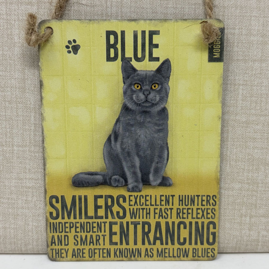 A rectangular hanging sign with an illustration of a grey blue cat. The sign reads “BLUE” at the top and includes descriptive text about the cat
