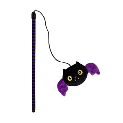 A Halloween-themed cat toy consisting of a black and purple striped wand with a black cord and a plush black bat head with purple wings and yellow eyes