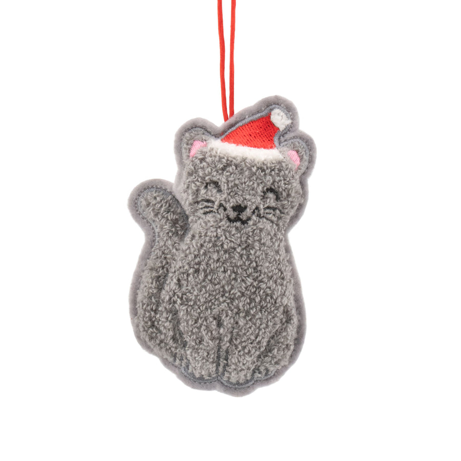 Grey cat-shaped hanging Christrmas tre ornament with a red Santa hat on a white background