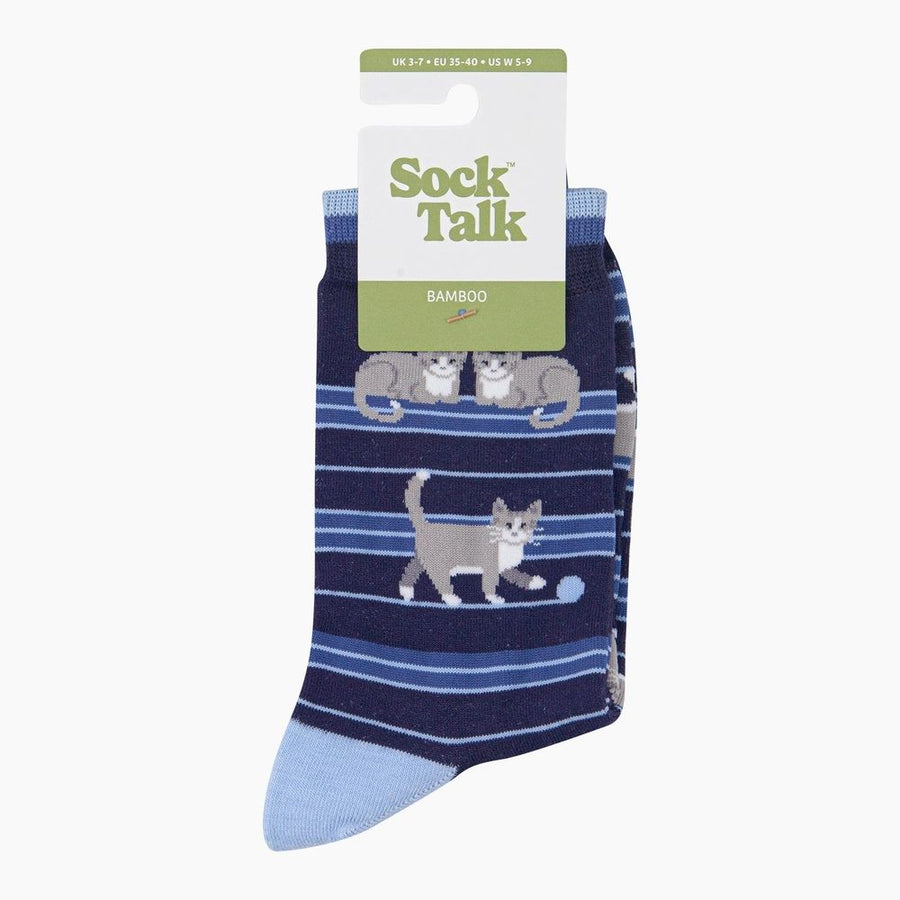 A pair of Sock Talk Bamboo crew socks featuring a navy blue and light blue striped pattern with cartoon grey and white cats