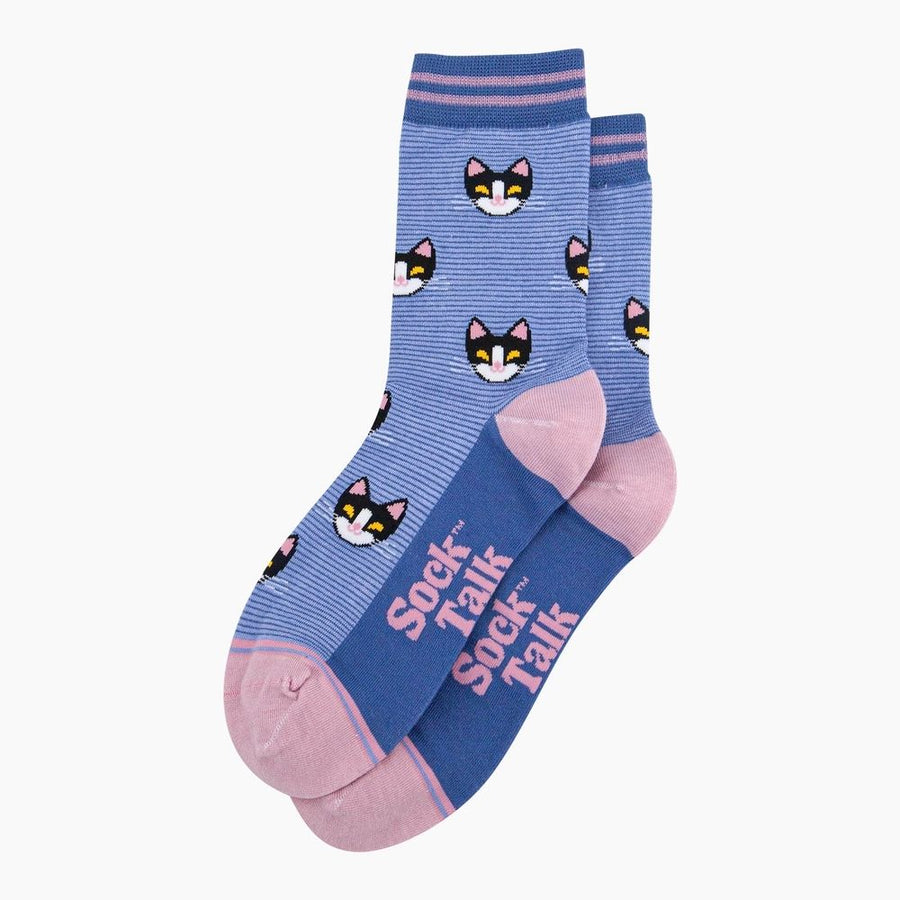 A pair of blue and pink crew socks with a cartoon cat face pattern and 'Sock Talk' branding, displayed on a clean white background.