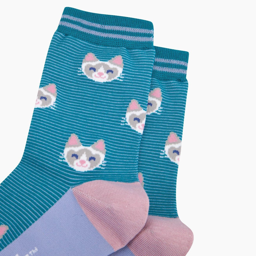 A pair of teal striped socks with a repeating pattern of cartoon cat faces, featuring light pink toes and heels