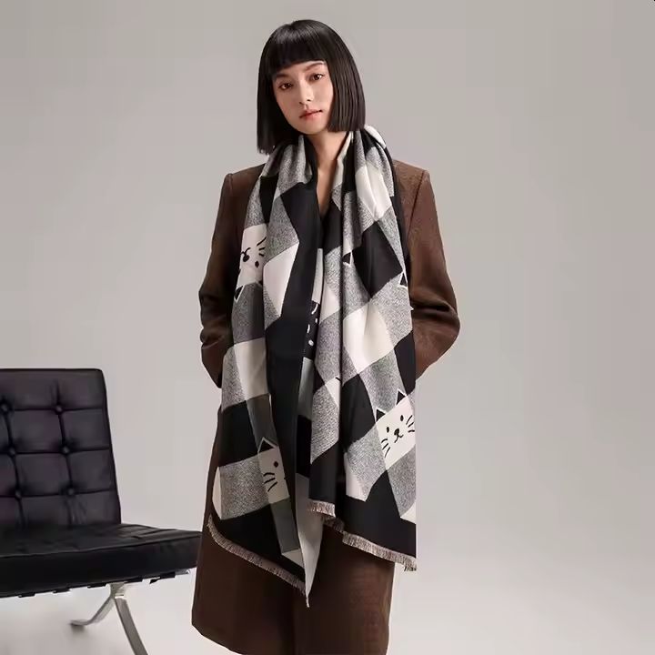 Lady wearing a Black and White Checked scarf with cat faces