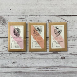 Three illustrated seed packets for literary-themed cat grass, cat mint and cat nip