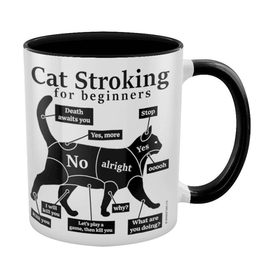 A white ceramic mug with a black handle and black interior, featuring a black graphic of a cat labeled 'Cat Stroking for beginners'