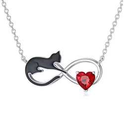 Necklace with a black cat and red heart design on a white background