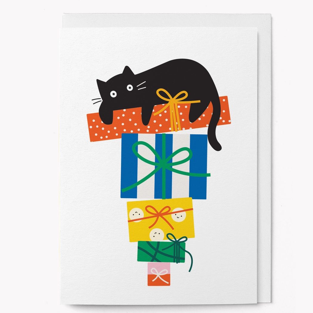 Playful Cat with Gifts Graphic Card