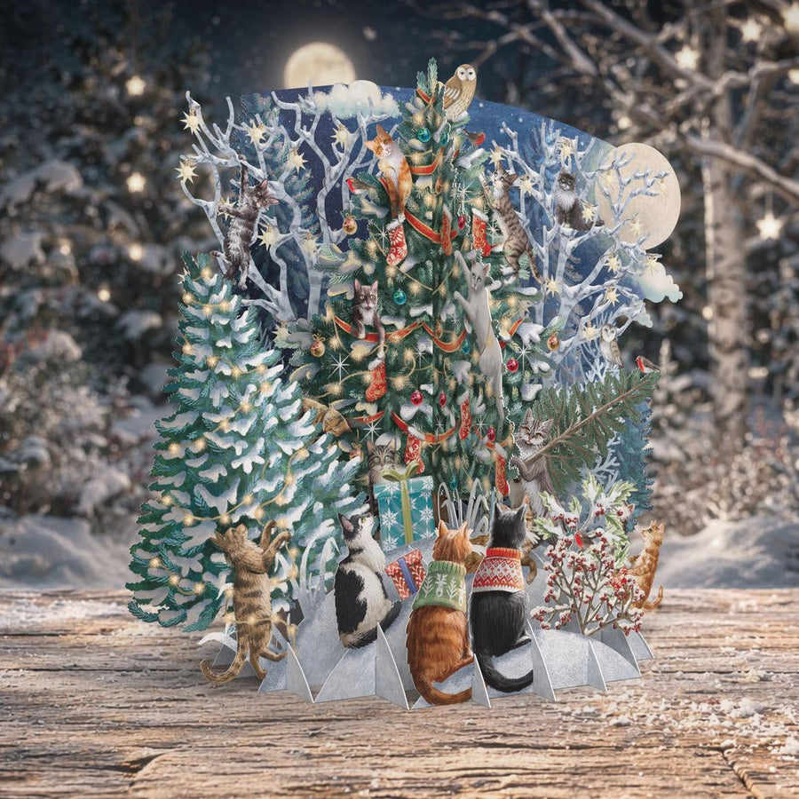 3D pop up card with cats around decorated Christmas trees in a snowy moonlit scene