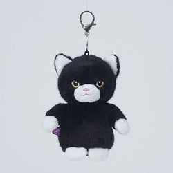 A black and white plush kitten keychain with a silver metal clasp