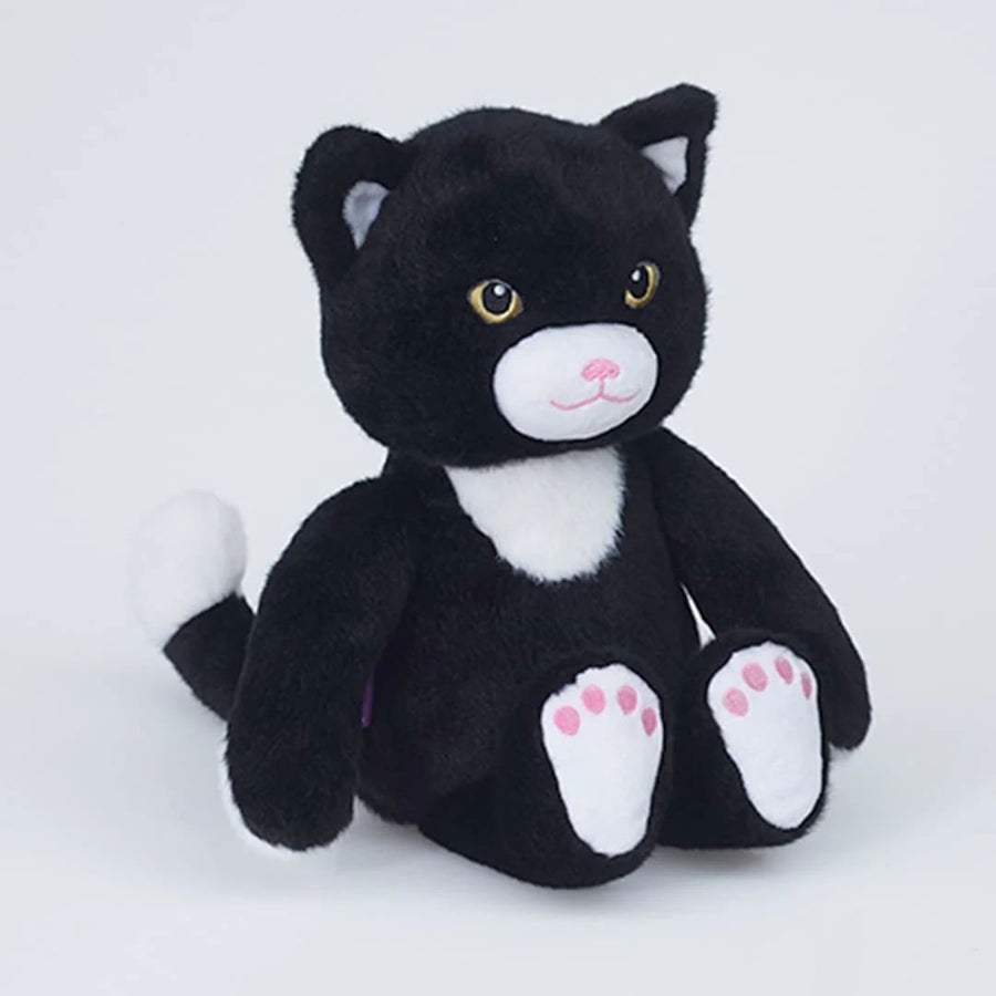 A black and white plush cat toy with yellow eyes, pink nose, and pink paw pads