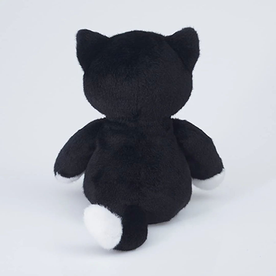 A black plush cat toy shown from the back, featuring white paws and a white-tipped tail
