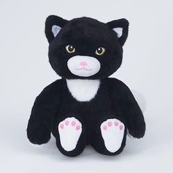 A black and white plush toy cat with embroidered yellow eyes, a pink nose, and pink paw pads