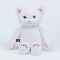 A white plush cat toy with pink inner ears, pink paw pads, and blue embroidered eyes. A Cats Protection purple tag is attached
