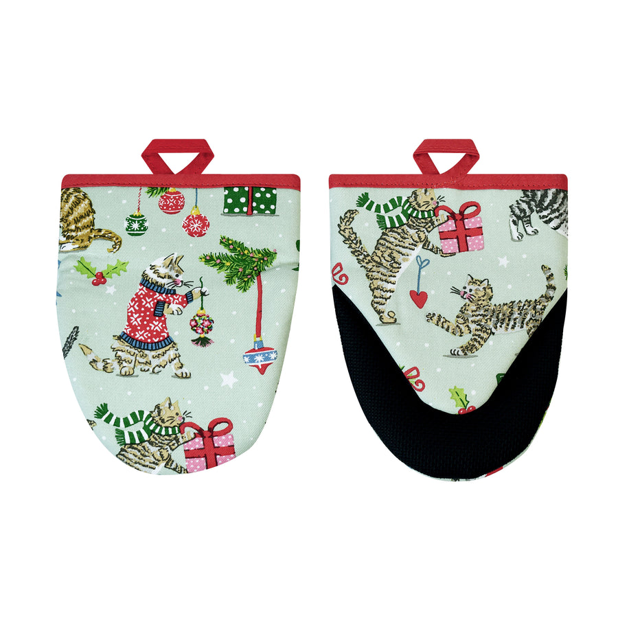 Pair of oven mitts with festive design featuring cats, trees, and presents on a light blue background.