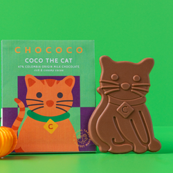Chococo cat-shaped milk chocolate next to its green and orange packaging box