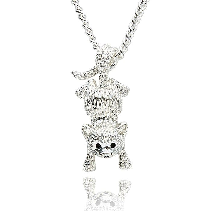 Silver cat-shaped pendant on a chain against a white background