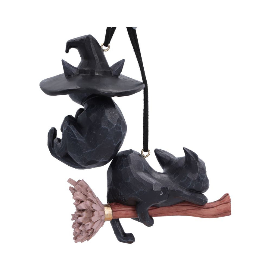 A Halloween hanging ornament featuring two black cats posed dynamically on and around a broomstick. 