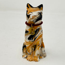 A marbled tortoiseshell Lucky Cat figurine wearing a burgundy collar with a gold letter B charm charm. Front view.