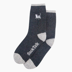 A pair of dark heather grey crew socks with light gray heels, toes, and cuffs, featuring a grey tabby embroidered cat logo