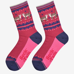 A pair of crew socks featuring a pink and navy blue Nordic pattern with walking cat illustrations