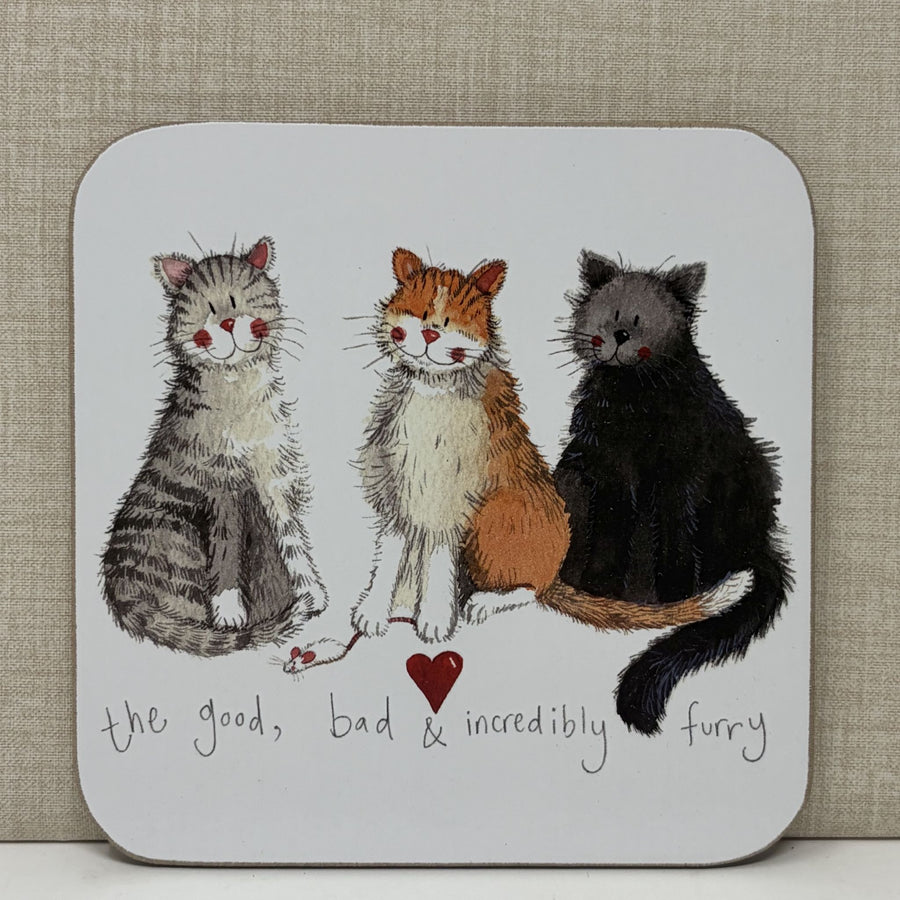 A square coaster with rounded corners featuring an illustration of three cats in grey, orange, and black, with the text 'the good, bad & incredibly furry' underneath.