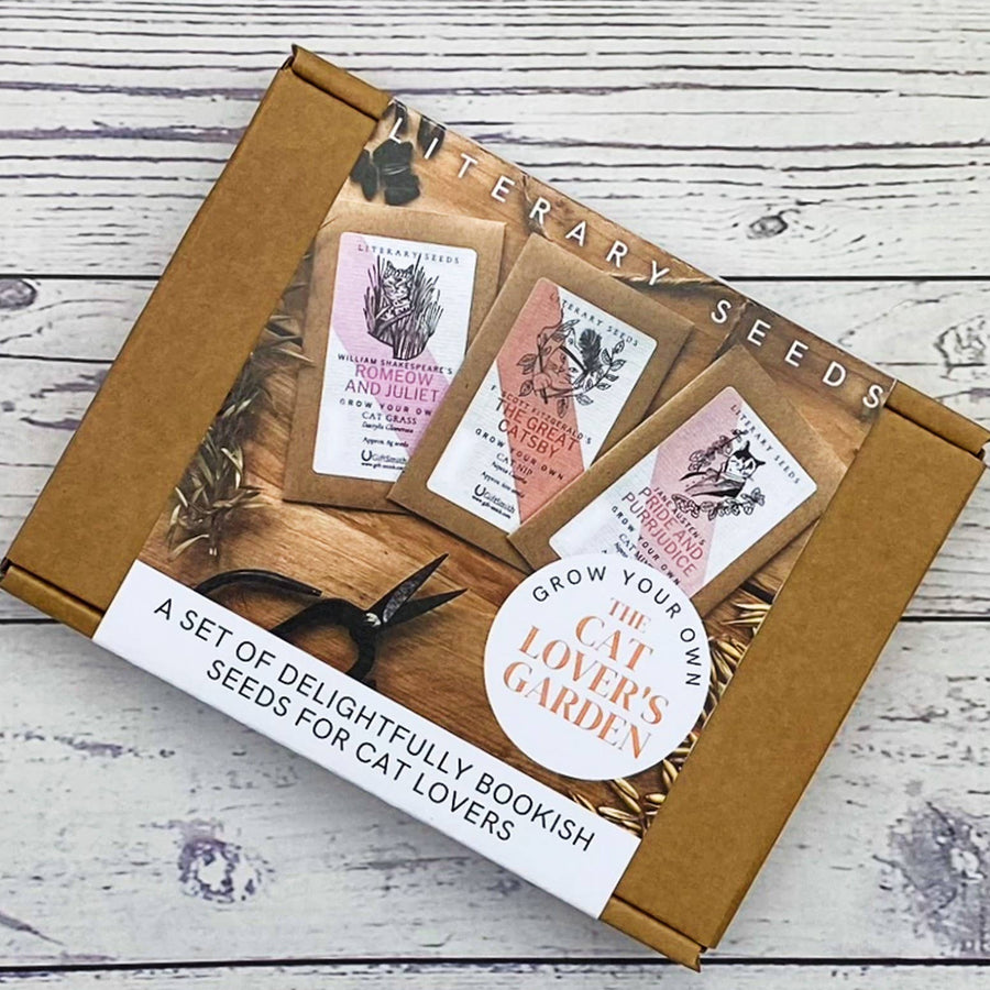 A boxed set of bookish seeds for cat lovers, with printed illustrations of books and a sticker reading 'Grow Your Own The Cat Lover's Garden
