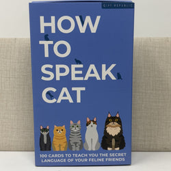 A blue card deck box titled 'HOW TO SPEAK CAT' with illustrated cats along the bottom and the Gift Republic brand at the top