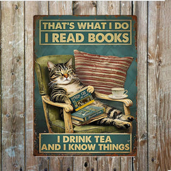 Vintage-style sign with a cat reading a book, drinking tea, and text 'That's what I do. I read books