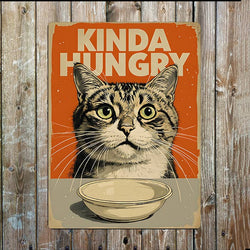 A rectangular vintage-style design featuring a tabby cat above a bowl, with the text 'KINDA HUNGRY' on an orange background