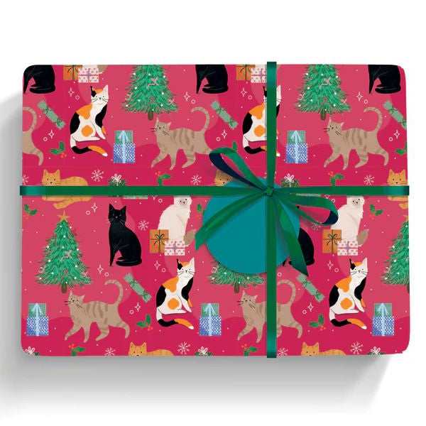 Gift wrap with cat and Christmas tree pattern on a red background